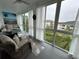Bright sunroom featuring comfortable seating, large windows, and scenic views at 3272 Lake Bayshore Dr # 515, Bradenton, FL 34205