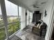 Bright sunroom with wicker furniture, multiple windows, and pleasant outdoor views at 3272 Lake Bayshore Dr # 515, Bradenton, FL 34205