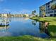 Scenic water view showcasing the lakefront and manicured grounds of the community at 3272 Lake Bayshore Dr # 515, Bradenton, FL 34205