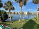 Lake view from the property, complemented by palm trees and a relaxing atmosphere at 3272 Lake Bayshore Dr # 515, Bradenton, FL 34205