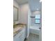 A modern bathroom with an updated tub, shower and granite vanity at 3387 Tupelo Ave, North Port, FL 34286