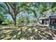 View of backyard, trees, grass, water, and deck at 3428 Mineola Dr, Sarasota, FL 34239