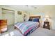 This bedroom features a comfortable bed, neutral walls, and carpeted floors at 3428 Mineola Dr, Sarasota, FL 34239
