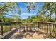 Inviting deck overlooking a serene pond, perfect for relaxing and enjoying nature's beauty at 3428 Mineola Dr, Sarasota, FL 34239