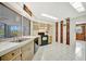 Well-lit kitchen with modern appliances, tile floors, and a view of the outdoor patio at 3428 Mineola Dr, Sarasota, FL 34239