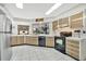 Bright kitchen featuring tile floors, modern appliances and a view of the backyard at 3428 Mineola Dr, Sarasota, FL 34239