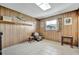 Cozy room with wood paneling and tile flooring at 3428 Mineola Dr, Sarasota, FL 34239