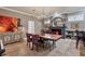 Dining room with decorative chandelier, fireplace, and tiled flooring at 3837 Camino Real, Sarasota, FL 34239