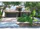 Charming single Gathering home with a well-maintained lawn, beautiful landscaping, and a tile roof at 3837 Camino Real, Sarasota, FL 34239