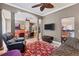 Open-concept living room with elegant pillars, multiple seating areas, and modern decor at 3837 Camino Real, Sarasota, FL 34239