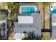 Aerial view of the property with a screened pool, well-maintained roof, and lush surroundings at 3975 Coleridge Pl, Sarasota, FL 34241