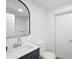Clean bathroom with a modern vanity, toilet, and a shower with glass doors at 3975 Coleridge Pl, Sarasota, FL 34241
