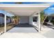 Spacious carport providing covered parking with clean white paint and ample space for vehicles at 3975 Coleridge Pl, Sarasota, FL 34241