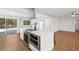 Modern kitchen featuring a center island with a cooktop and stainless steel appliances at 3975 Coleridge Pl, Sarasota, FL 34241