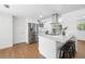 Bright kitchen with stainless steel appliances, white cabinets, and quartz countertops at 3975 Coleridge Pl, Sarasota, FL 34241