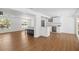 Open concept living space featuring wood floors and seamless flow into a modern kitchen at 3975 Coleridge Pl, Sarasota, FL 34241