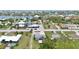 Aerial view showcasing the home's location in a residential area with nearby waterways at 404 Bayshore Rd, Nokomis, FL 34275