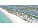 Scenic aerial shot of a waterfront community with stunning beaches and canal access at 404 Bayshore Rd, Nokomis, FL 34275
