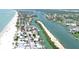 High angle aerial showing canal front real estate, sandy beaches, and intercoastal waterways at 404 Bayshore Rd, Nokomis, FL 34275