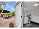 View from the patio to a lovely bathroom with a modern vanity and beach-themed décor at 404 Bayshore Rd, Nokomis, FL 34275