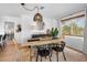 Stylish dining area featuring modern decor, a rustic table, and bright natural light at 404 Bayshore Rd, Nokomis, FL 34275