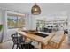 Inviting dining area featuring a modern table, tasteful decor, and seamless access to the living room at 404 Bayshore Rd, Nokomis, FL 34275