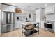 Well-lit kitchen boasts stainless steel appliances, a convenient island, and ample storage space at 404 Bayshore Rd, Nokomis, FL 34275
