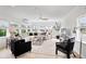 Bright living room features large windows, modern decor, and comfortable seating for a relaxing atmosphere at 404 Bayshore Rd, Nokomis, FL 34275