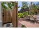 A private outdoor shower and patio area shaded by an umbrella at 404 Bayshore Rd, Nokomis, FL 34275