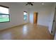 Bright, open bedroom with tile floors, neutral walls, and ample natural light at 4077 River Bank Way, Punta Gorda, FL 33980
