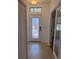 Inviting entryway with decorative glass door and tiled flooring, creating a warm welcome into the home at 4077 River Bank Way, Punta Gorda, FL 33980