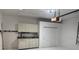 Well-organized garage featuring a work bench area and plenty of storage cabinets at 4077 River Bank Way, Punta Gorda, FL 33980