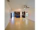 Open floor plan featuring kitchen with tile floors, stainless steel appliances, and an island with bar seating at 4077 River Bank Way, Punta Gorda, FL 33980