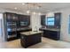 Modern kitchen features granite counters, stainless appliances, and center island at 4077 River Bank Way, Punta Gorda, FL 33980