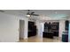 Open floor plan featuring kitchen with tile floors, stainless steel appliances, and island with bar seating at 4077 River Bank Way, Punta Gorda, FL 33980