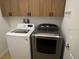Laundry room featuring front load washer and dryer at 4077 River Bank Way, Punta Gorda, FL 33980
