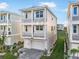 Charming coastal home featuring multiple balconies and a manicured lawn at 4318 Marina View Way, Cortez, FL 34215