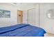 Bright bedroom with a full bed, neutral walls, and a ceiling fan at 4484 Tortoise Rd, Venice, FL 34293