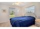 Comfortable bedroom with a full bed, neutral walls, and a ceiling fan at 4484 Tortoise Rd, Venice, FL 34293