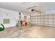 Spacious garage with a concrete floor, a door to the outside, and a rolling garage door at 4484 Tortoise Rd, Venice, FL 34293