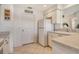 Bright white kitchen featuring a clean design with tile floors and neutral counters at 4484 Tortoise Rd, Venice, FL 34293
