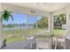Covered lanai with scenic lake views, perfect for relaxing and enjoying the outdoors at 4484 Tortoise Rd, Venice, FL 34293