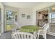 Screened lanai with seating and a glimpse into the house, offering a tranquil outdoor space at 4484 Tortoise Rd, Venice, FL 34293