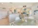 Open living area featuring tile floors, breakfast bar and view to living area at 4484 Tortoise Rd, Venice, FL 34293