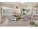 Open-concept living space with tile flooring, vaulted ceilings, and easy access to the kitchen at 4484 Tortoise Rd, Venice, FL 34293