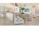 Comfortable living room with tile flooring and an open view to the kitchen, creating a seamless flow at 4484 Tortoise Rd, Venice, FL 34293