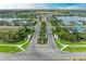 An aerial view of the entrance to the community with manicured landscaping and well-maintained roads leading to beautiful homes at 4625 Canoe Creek Ave, Parrish, FL 34219