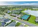 A lush community featuring a clubhouse, sparkling pool, and tennis courts surrounded by lakes and well-manicured landscaping at 4625 Canoe Creek Ave, Parrish, FL 34219
