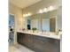 Bathroom featuring double sinks, vanity, and modern finishes at 4625 Canoe Creek Ave, Parrish, FL 34219