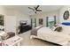 Serene bedroom with ample space, featuring large windows, modern decor, and comfortable furnishings at 4625 Canoe Creek Ave, Parrish, FL 34219